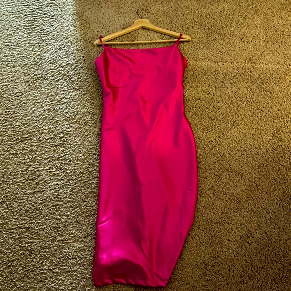 Selling brand new never worn pink dress. Size medium.